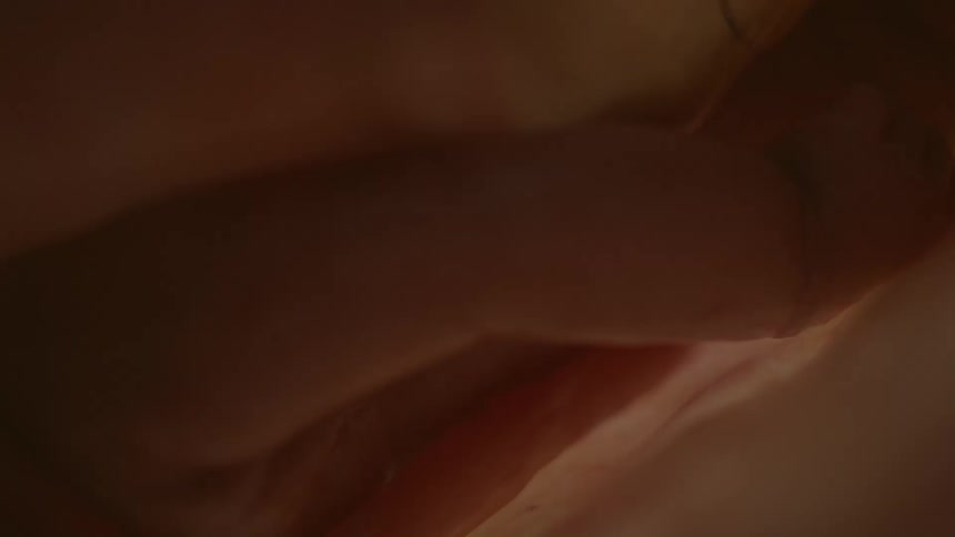 Light shines over moving mass of flesh and skin