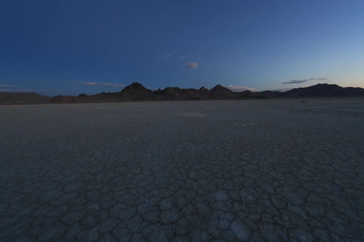 Time-lapse of the day beginning to shine on an open plain