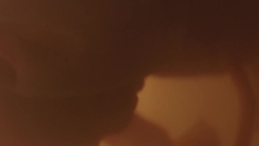 Unborn baby with arms and umbilical cord in the womb