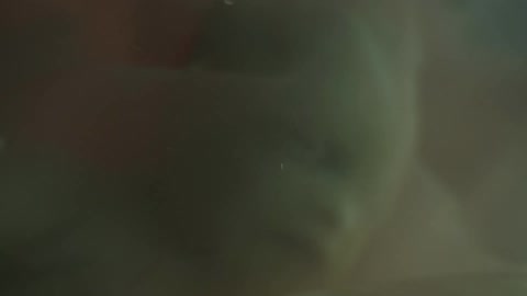 Unborn human baby face wrapped in the womb