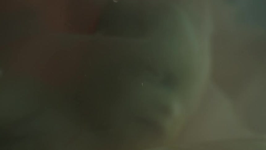 Unborn human baby face wrapped in the womb