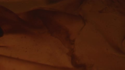 Liquid with layers moving gently in low light