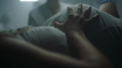 Pregnant woman in labour gives birth to a child