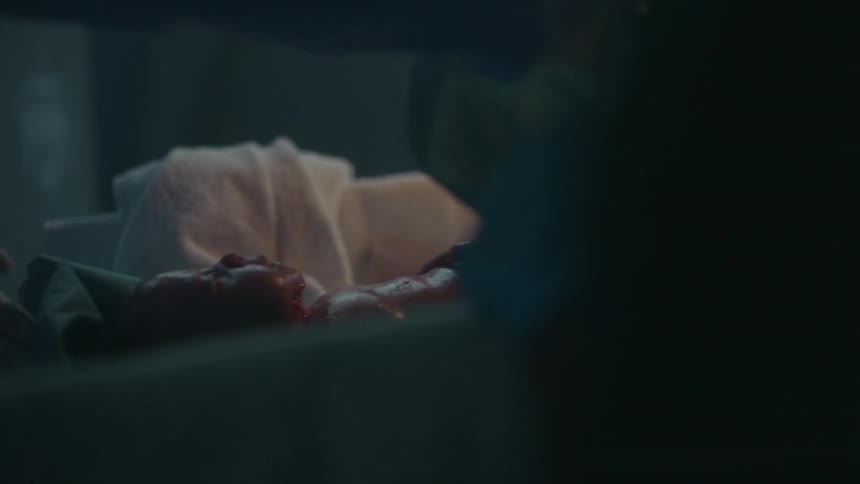 Medical professionals tending to a newborn baby in a hospital