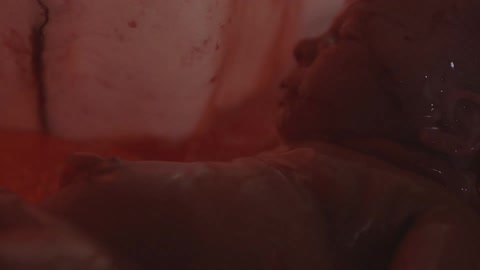 A fetus inside an emptying amniotic sac