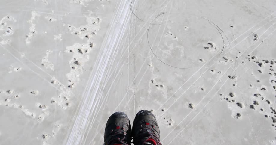 View of persons feet as they hover over the ground