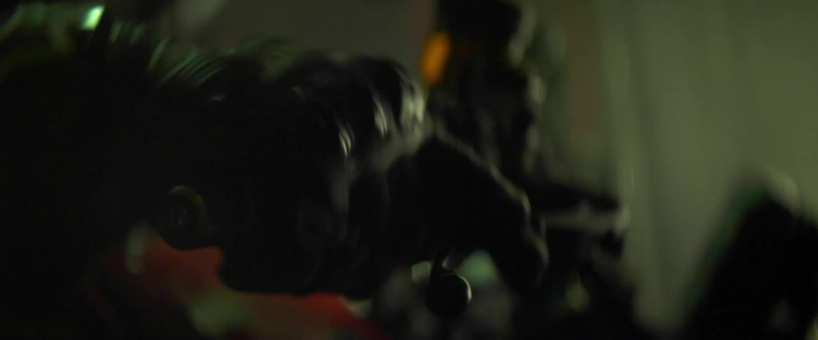A person throttles a motorcycle with a gloved hand