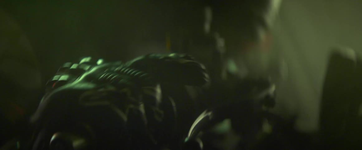 Hand wearing a leather glove revving a handle on a motorcycle