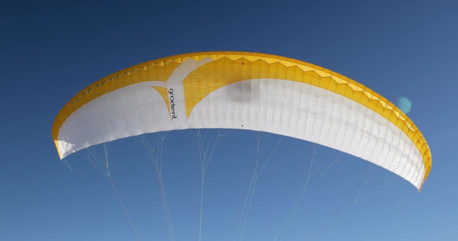 A parachute soars in the air