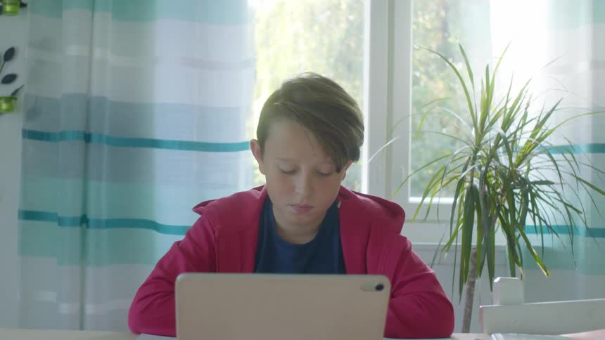 Young male student distance learning at home