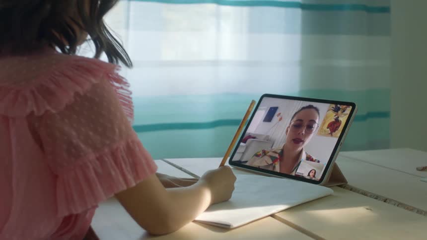 Student and teacher on a zoom class at home during a global pandemic