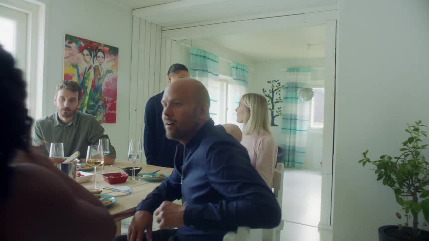 A family are having dinner together in the dining room