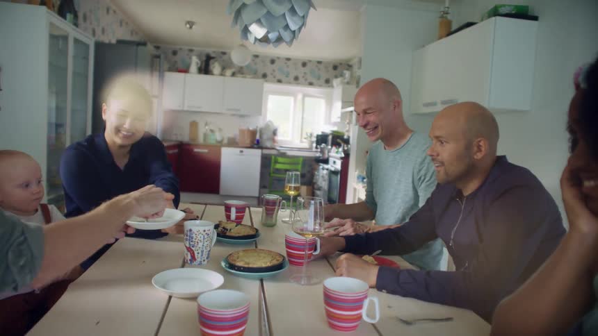 People are sitting down and pie is being served