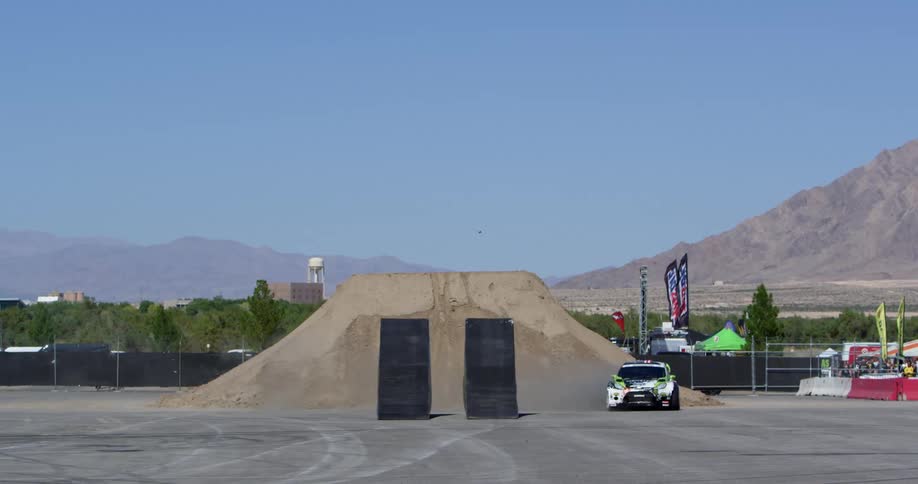 A race car drifts along a sports track road