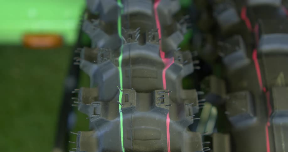 An extreme closeup of a rubber bike tire reveals its tread