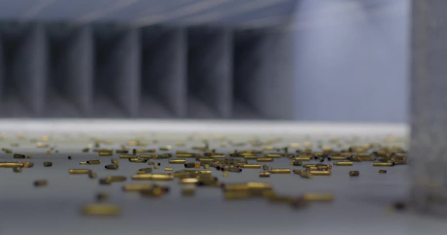 Empty shell casings litter floor in empty shooting range