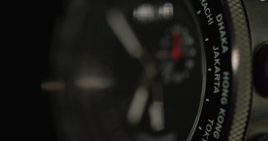 The second hand moves on a chronograph watch with a black face