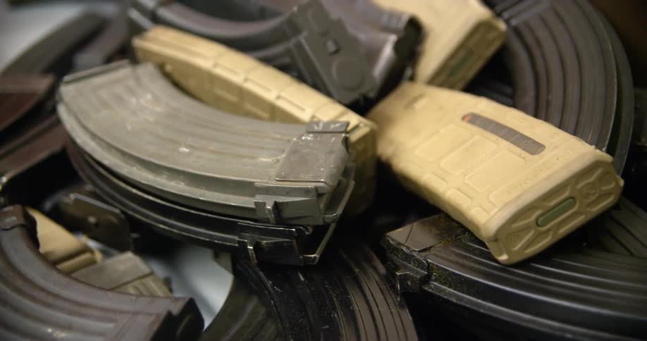 Beige and black gun grips stacked on top of each other