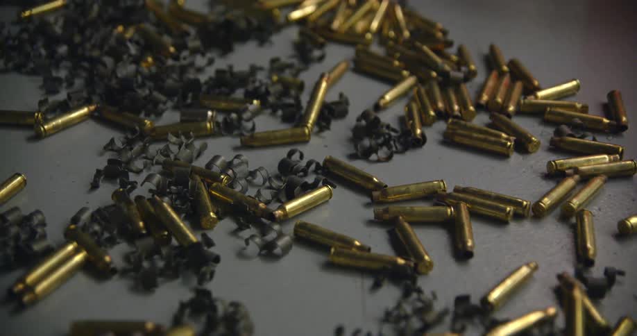 Bullets cover a gray surface