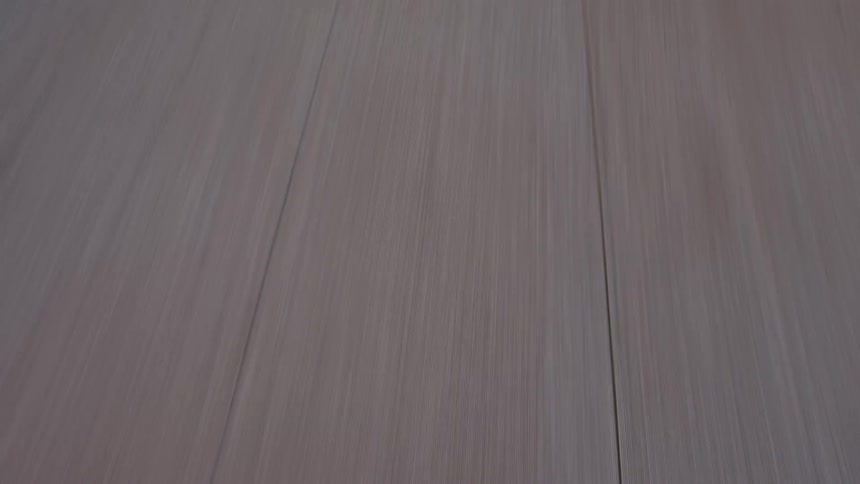 A sports car drives down a road