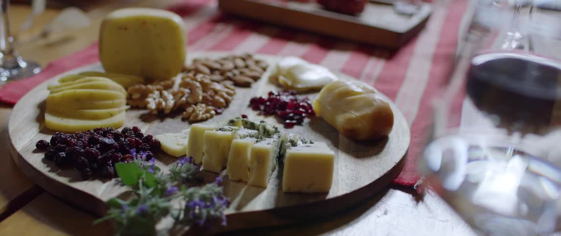 A chartreuse board on display next to wine glasses