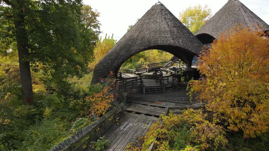 Shelters surrounded by fall trees in a public park