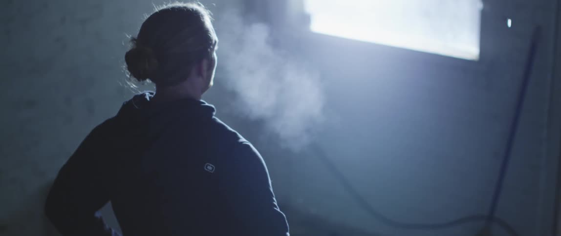 A man is standing inside a building