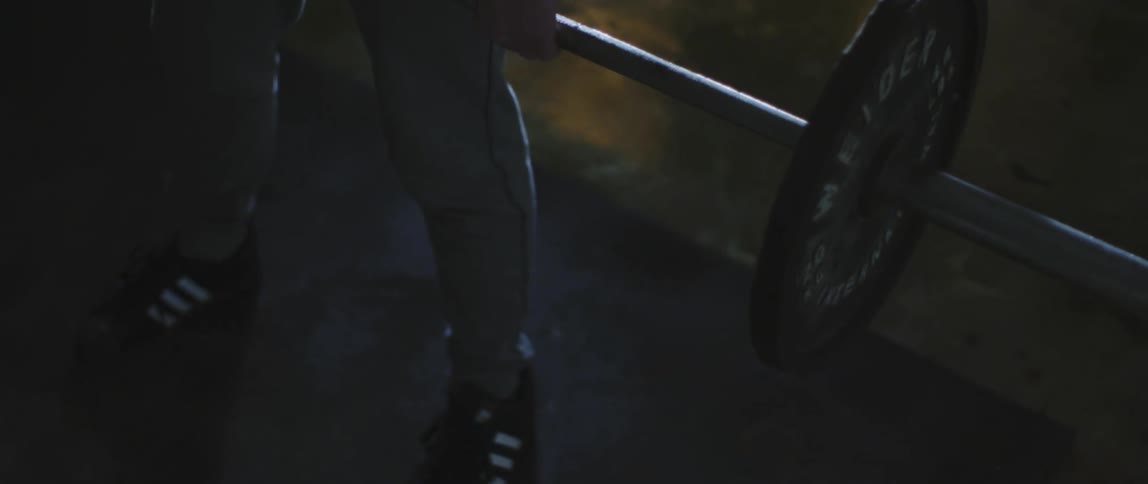 A person working out with weights on a barbell