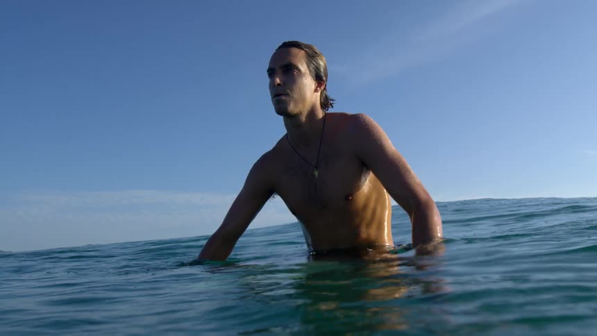 A man is floating in the water