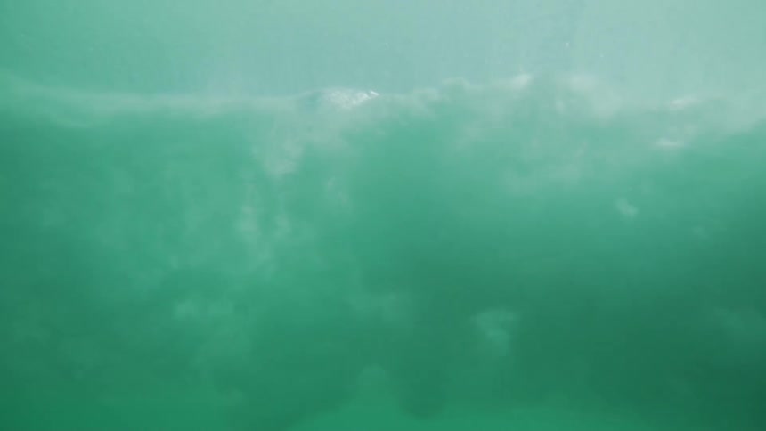 Waves crashing into each other from underwater in the ocean