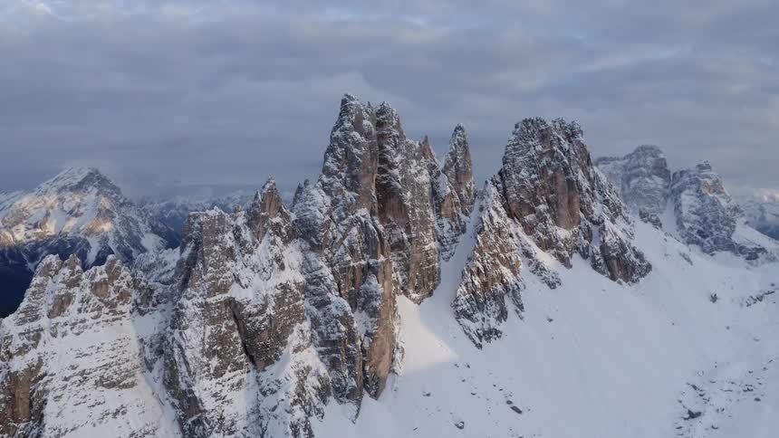 Aerial view of mountains in winter is displayed
