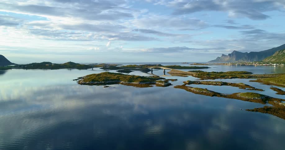 A landscape view of a lake with hills on the coast