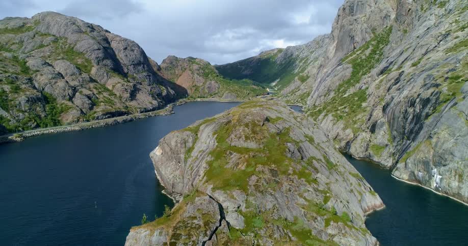 An aerial view of mountains surrounding a lake