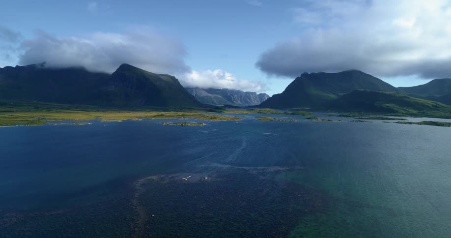 Mountain lake with mountain range plateau and a cloudy sky
