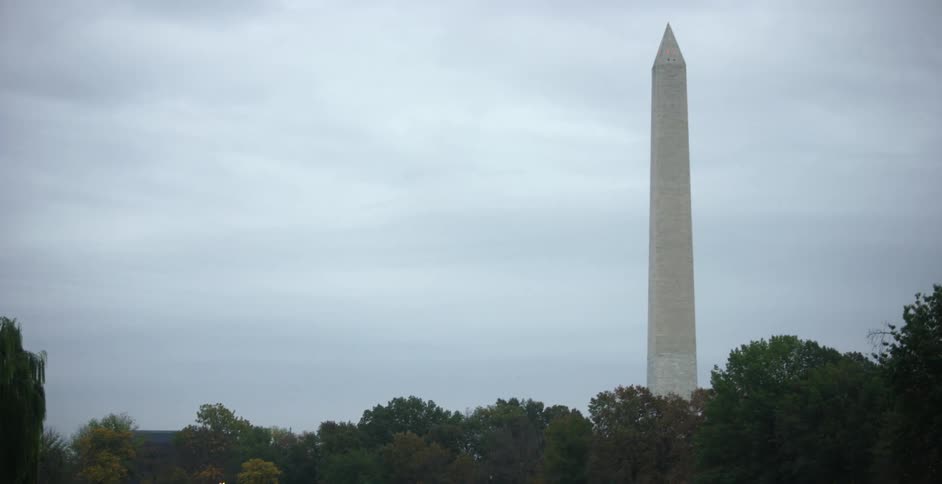 A monument in front of a lake