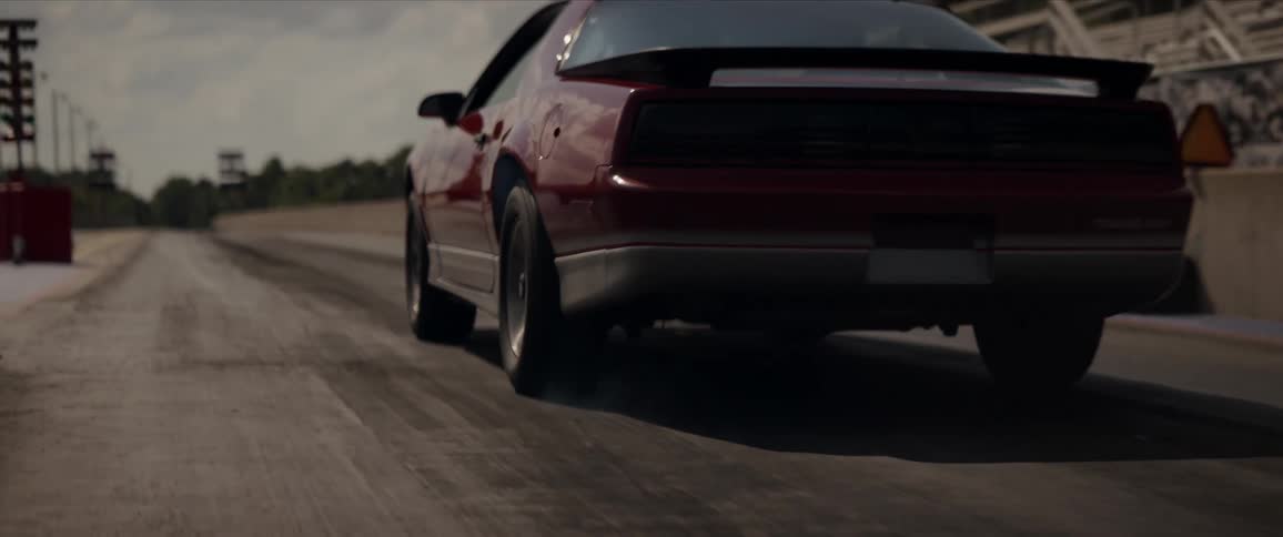 Sports car racing down the racing track