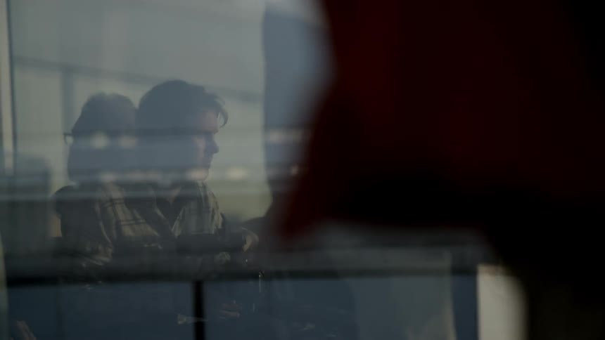 People sitting in an airport waiting area