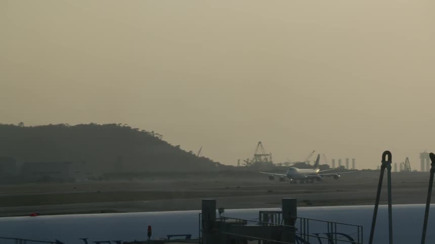 Large airplane rolling down a taxiway