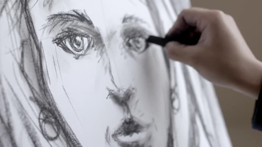 Artist sketches a woman's face