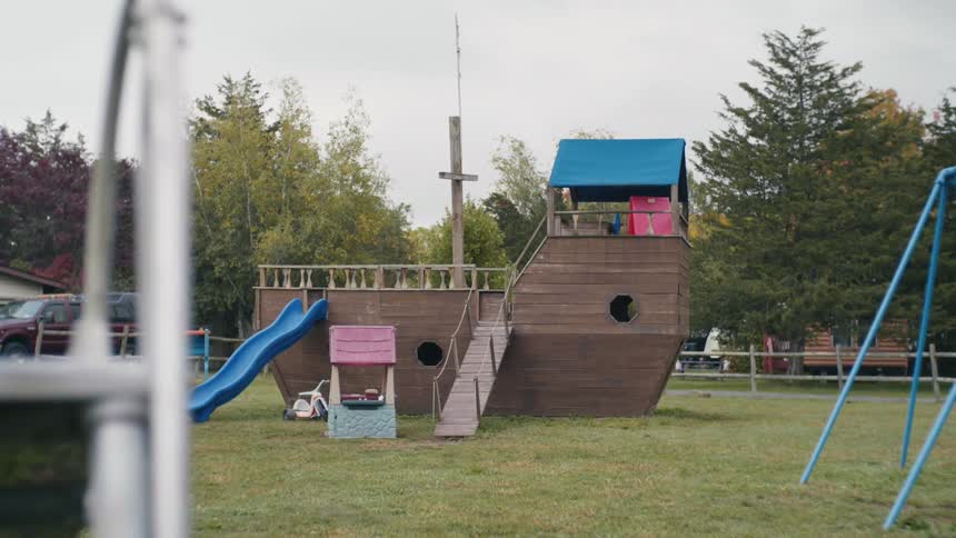 Ship themed play structure with a slide at a playground