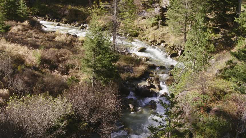 A river flowing over rocks and boulders in nature