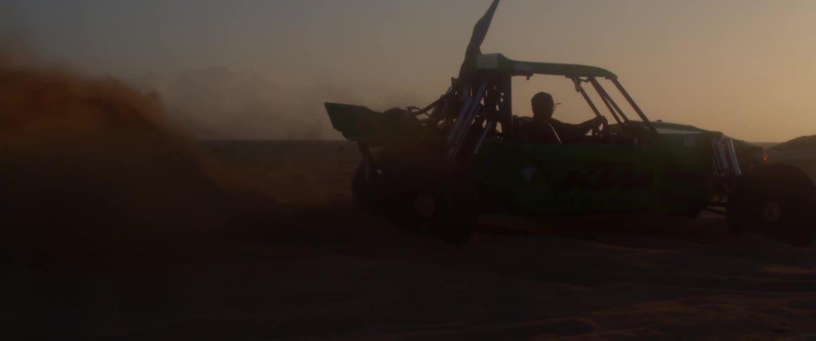 A man is driving a vehicle offroad