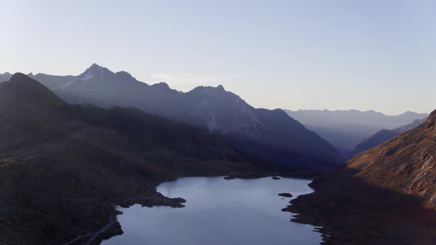 Mountains with river fjord and more mountains on the horizon