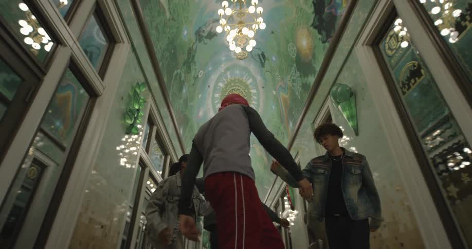 Group of young people dancing on a luxurious corridor
