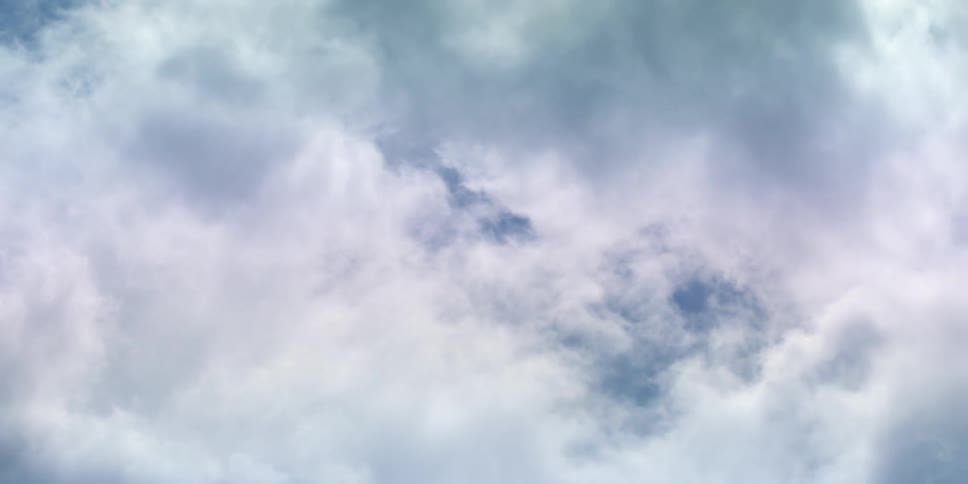White clouds float in the blue sky