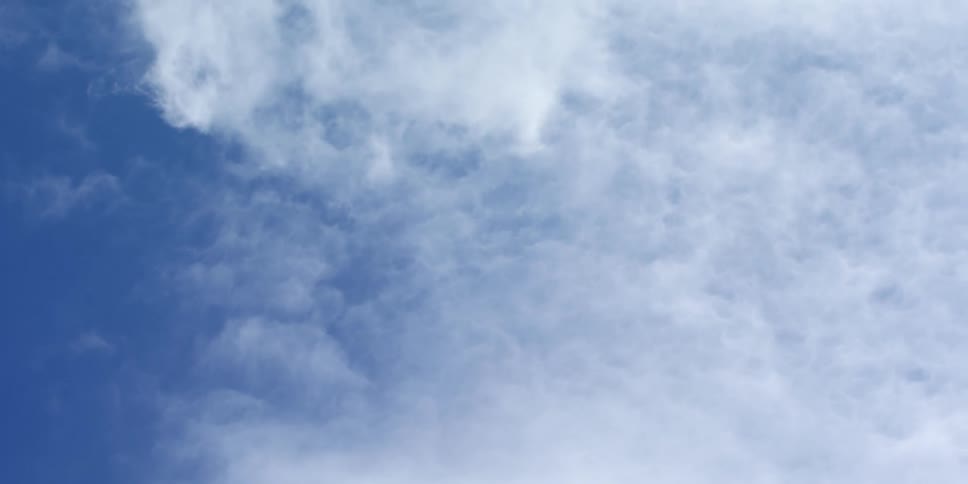 White clouds floating in a blue sky