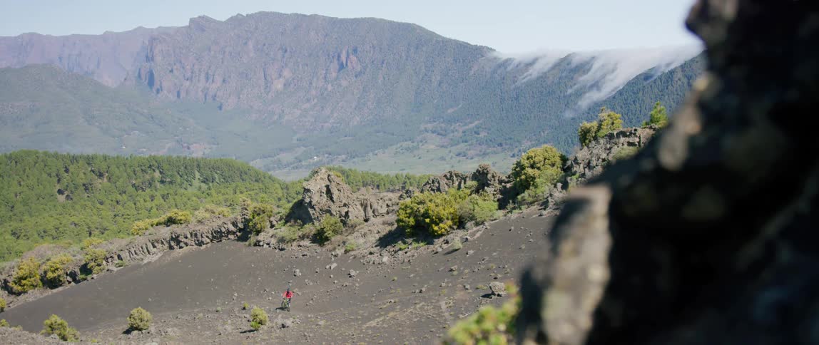 View of mountains and a valley with cleared land to dirt