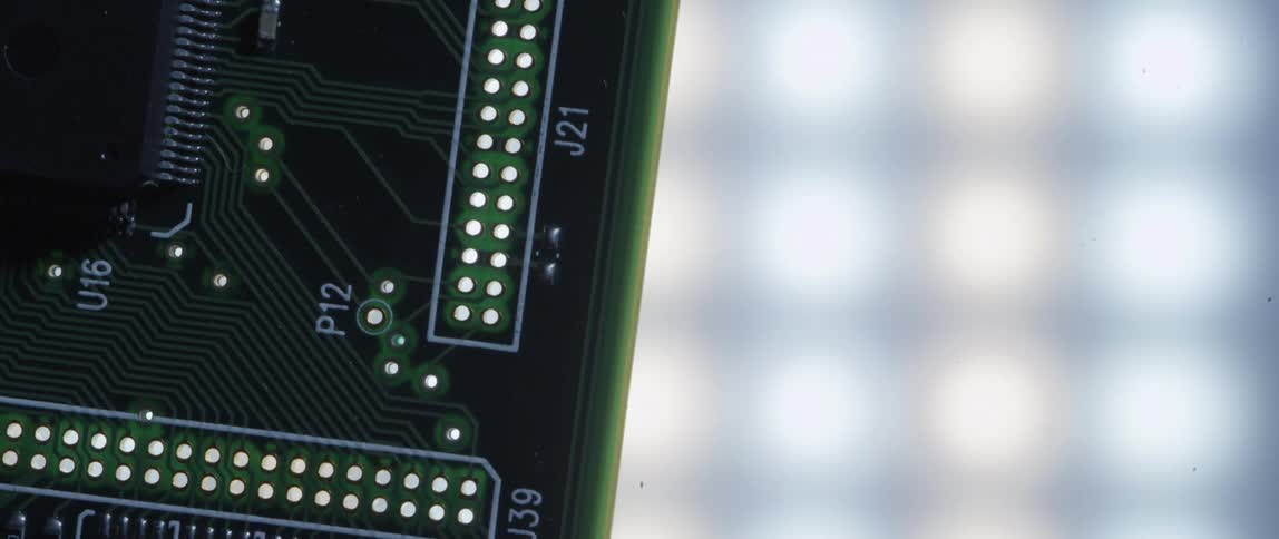 The camera twists around the edge of a printed circuit board