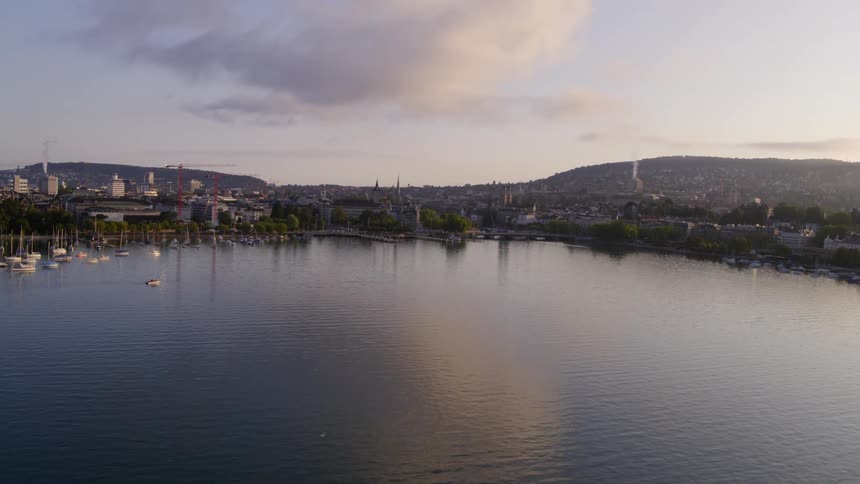 Aerial view of a small town near a lake at sunset