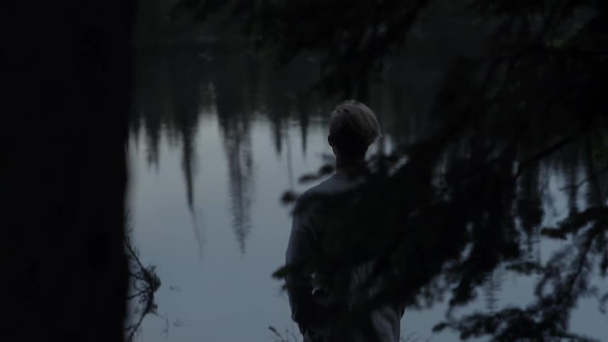 A man looking out over a body of water